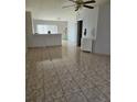 Spacious living room with tile floors and a ceiling fan at 4240 Settlers Ct, St Cloud, FL 34772