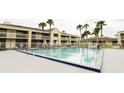 Refreshing swimming pool with surrounding lounge chairs at 5245 W Irlo Bronson Memorial Hwy # 115, Kissimmee, FL 34746