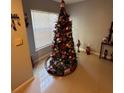 Christmas tree in corner of living room at 4320 S Kirkman Rd # 1513, Orlando, FL 32811