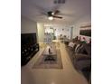 Living room with comfortable seating, ceiling fan, and tile flooring at 4320 S Kirkman Rd # 1513, Orlando, FL 32811
