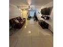 Spacious living room with tile flooring and large window, perfect for holiday gatherings at 4368 S Kirkman Rd # 201, Orlando, FL 32811