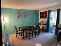 Dining area with a table, chairs, and decorative wall hangings at 508 Orange Dr # 20, Altamonte Springs, FL 32701