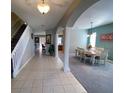 Two-story foyer with tile floors and archway at 842 Sussex Dr, Davenport, FL 33896