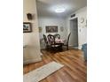 Bright dining area with wood floors and a table set for four at 1600 W Lake Parker Dr # B23, Lakeland, FL 33805