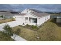 One story house with solar panels, view of the lake at 420 Watusi Way, St Cloud, FL 34772
