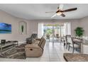 Spacious living room with access to pool and patio at 4735 Terrasonesta Dr, Davenport, FL 33837