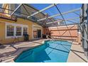 Private screened-in pool with a paved patio area at 8535 Bay Lilly Loop, Kissimmee, FL 34747