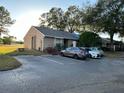 Condo exterior view, showing parking and landscaping at 949 Pebble Creek Cir, Orlando, FL 32824