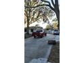 Red truck parked in a driveway with large trees at 1750 12Th St, Clermont, FL 34711