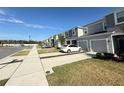 Townhome community with multiple two-story units and parking at 1861 Roosevelt Pl, St Cloud, FL 34769