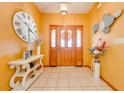 Inviting entryway with tiled floors and an oversized clock at 2801 S Granada Blvd, Kissimmee, FL 34746