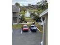 View of parking lot and lake from balcony at 4728 Walden Cir # 37, Orlando, FL 32811