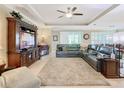 Large living room with sectional and built-in entertainment center at 681 San Joaquin Rd, Poinciana, FL 34759