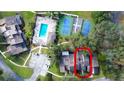 Aerial view showing home, pool, and tennis courts at 72 Aspen Dr, Haines City, FL 33844