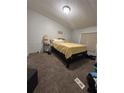 Guest bedroom with carpeted floor and a full bed at 8185 County Road 109, Lady Lake, FL 32159