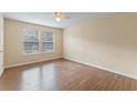 Bright bedroom with wood flooring and dual windows at 5980 Westgate Dr # Apt 103, Orlando, FL 32835