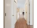Bright hallway with wood flooring, leading to other rooms at 5980 Westgate Dr # Apt 103, Orlando, FL 32835