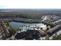 Community features a lakefront resort-style pool, clubhouse and lush landscaping at 2627 Bugatti Ct, Kissimmee, FL 34746