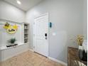 Bright entryway with built-in bench and storage at 4626 Terrasonesta Dr, Davenport, FL 33837