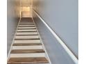 Modern staircase with wood and white accents at 720 Siena Palm Dr # 202, Celebration, FL 34747