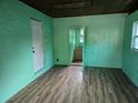 Spacious living room with wood-look floors and an open layout at 1420 Ne 22Nd St, Ocala, FL 34470