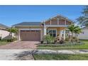 Well maintained home with lush landscaping and a two car garage at 5043 Vantage Ct, St Cloud, FL 34772