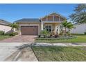 Newly built home with attractive landscaping, a 2 car garage and inviting porch at 5043 Vantage Ct, Saint Cloud, FL 34772