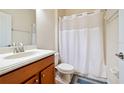 Clean bathroom with shower/tub combo and wood vanity at 8958 Sugar Palm Rd, Kissimmee, FL 34747