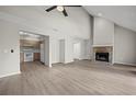 Spacious living room with brick fireplace and laminate floors at 1621 Ne 2Nd St # 203, Ocala, FL 34470