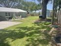 Large backyard with spacious lawn and shed at 4040 Ne 95Th Rd, Wildwood, FL 34785
