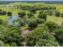 Aerial view of property showing home and pond at 6225, 6229 Deen Still Rd, Lakeland, FL 33809