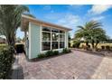 Exterior view of a light blue guest house with a patio at 3250 Red Tail Hawk Dr, Polk City, FL 33868