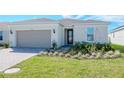 New construction home with paver driveway at 1991 Spring Shower Cir, Kissimmee, FL 34744