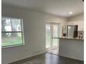 Bright living room with hardwood floors and French doors leading outside at 407 Nw 8Th St, Mulberry, FL 33860