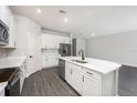 Open concept kitchen with island and stainless steel appliances at 3327 Chinotto Dr, Lake Alfred, FL 33850