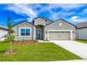 Single-story home with two-car garage at 3326 Chinotto Dr, Lake Alfred, FL 33850