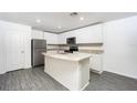 Open concept kitchen with granite countertops at 3199 Seville St, Lake Alfred, FL 33850
