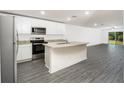 Modern kitchen with stainless steel appliances and island at 3199 Seville St, Lake Alfred, FL 33850