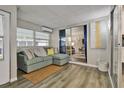 Bright sunroom with comfortable seating and access to other rooms at 1610 Reynolds Rd # 5, Lakeland, FL 33801