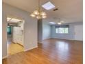 Bright dining room with laminate flooring and access to kitchen at 10161 Sw 87Th Ter, Ocala, FL 34481