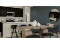 Modern kitchen with island and breakfast bar at 3990 Willowbrook Dr, Edgewater, FL 32141