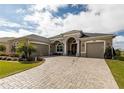 Stunning curb appeal of this two-story home at 8339 Bridgeport Bay Cir, Mount Dora, FL 32757