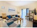 Living room with comfy seating and access to patio at 2705 Bushman Dr, Kissimmee, FL 34746