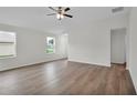 Bright and spacious living room featuring hardwood floors and a ceiling fan at 560 Marion Oaks Mnr, Ocala, FL 34473