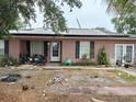 Ranch-style home with solar panels and needs landscaping at 136 Madera Dr, Winter Haven, FL 33880