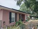 Side view of ranch home with solar panels at 136 Madera Dr, Winter Haven, FL 33880