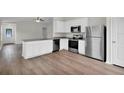 Kitchen boasts granite countertops and stainless steel appliances at 523 Marion Oaks Blvd, Ocala, FL 34473