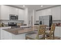 Modern kitchen with stainless steel appliances and an island at 2123 Green Valley St, Daytona Beach, FL 32124