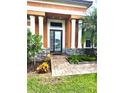 Front entry with columns and stone accents at 5446 Pebble Beach Dr, Lakeland, FL 33812