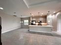 Modern kitchen with stainless steel appliances and an island at 210 Kenny Blvd, Haines City, FL 33844
